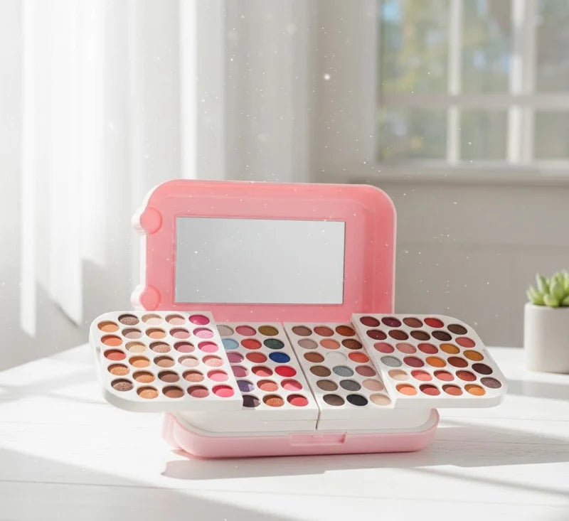 Makeup palette with various colors and a mirror on a white background