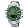 Casio watch with green face and silver metal strap on black background